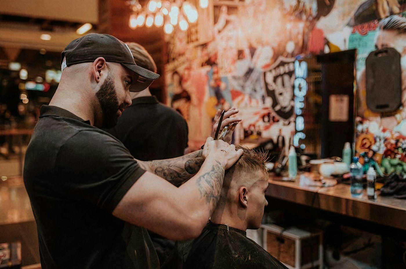 Illustrative example of a barber cutting a man's short hair with scissors, not RS staff or work